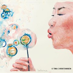 Woman-Blowing-Bubbles